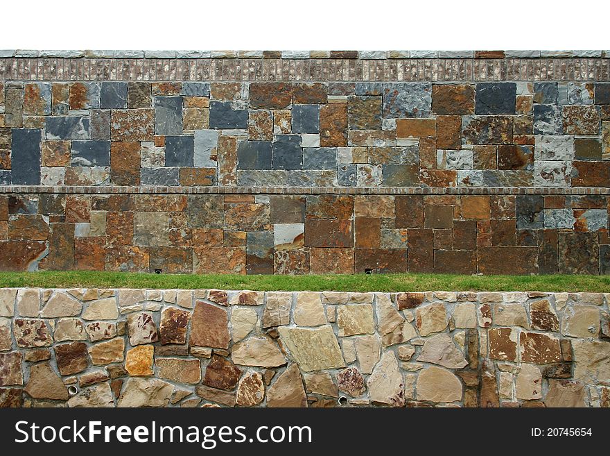 A multi-level rock retaining wall and fence. A multi-level rock retaining wall and fence.