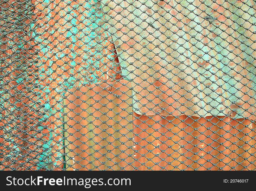 Rope wire in front of old rust metal sheet. Rope wire in front of old rust metal sheet.