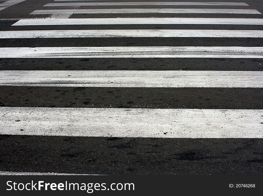 Pedestrian crossing on road at day