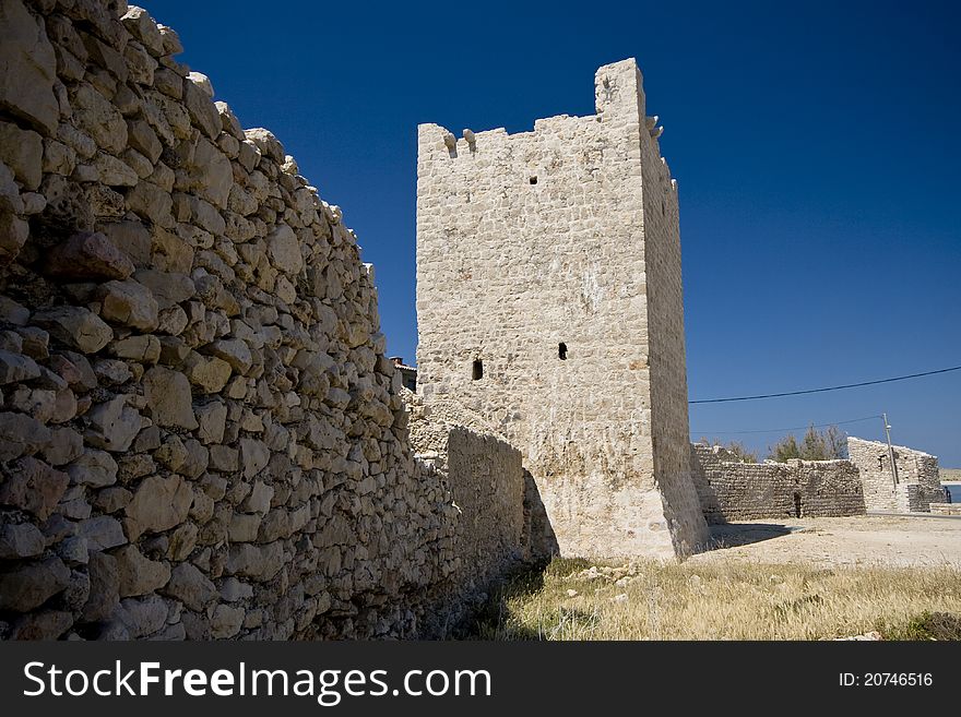 Medival stonemade tower and the stonewall in Razanac