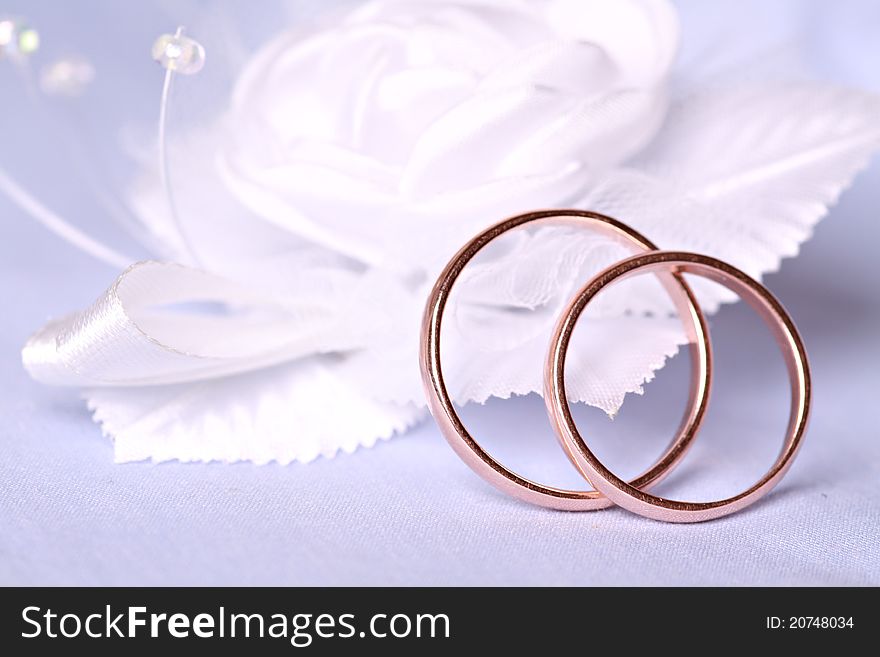 Wedding rings on blue background