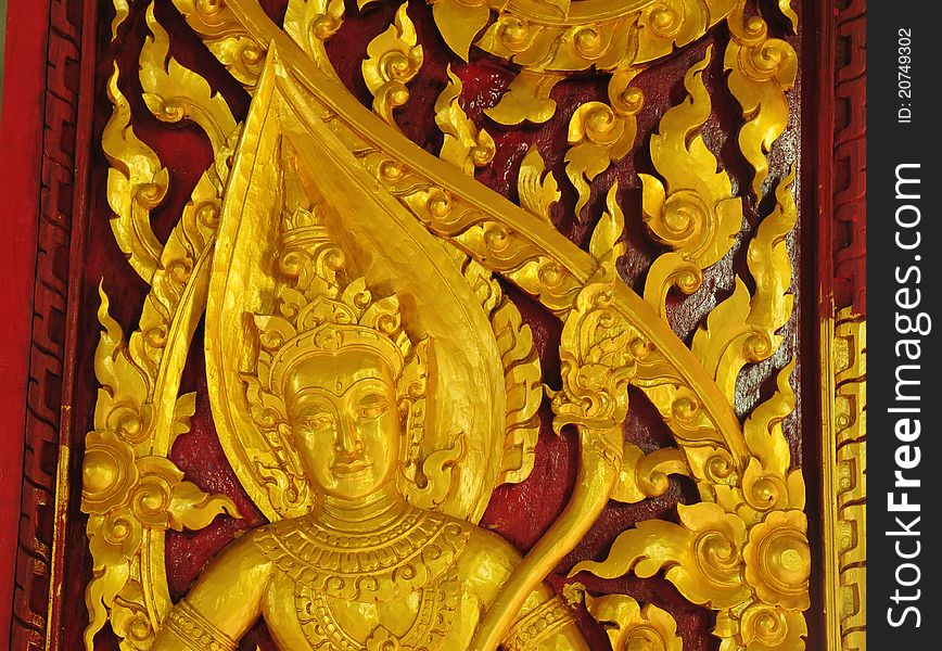 Traditional Thai style carving and painting art at the temple