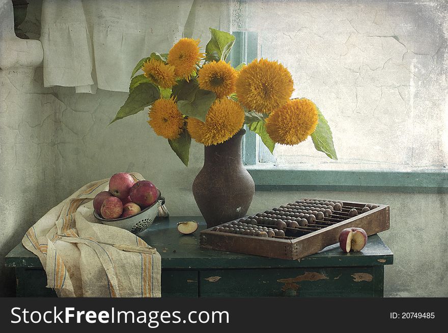 Still life with the bouquet of sunflowers and red apples. Still life with the bouquet of sunflowers and red apples