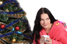 Girl With Cup In Bathrobe Next Christmas Tree Royalty Free Stock Photo