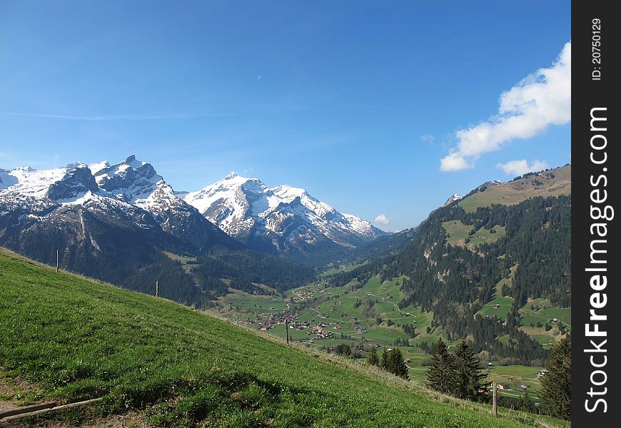 Mountains, called Oldenhorn and Schlauchhorn in the spring. Famous region of Saanenland. Place for summer skiing. Village called Gsteig bei Gstaad. Mountains, called Oldenhorn and Schlauchhorn in the spring. Famous region of Saanenland. Place for summer skiing. Village called Gsteig bei Gstaad.