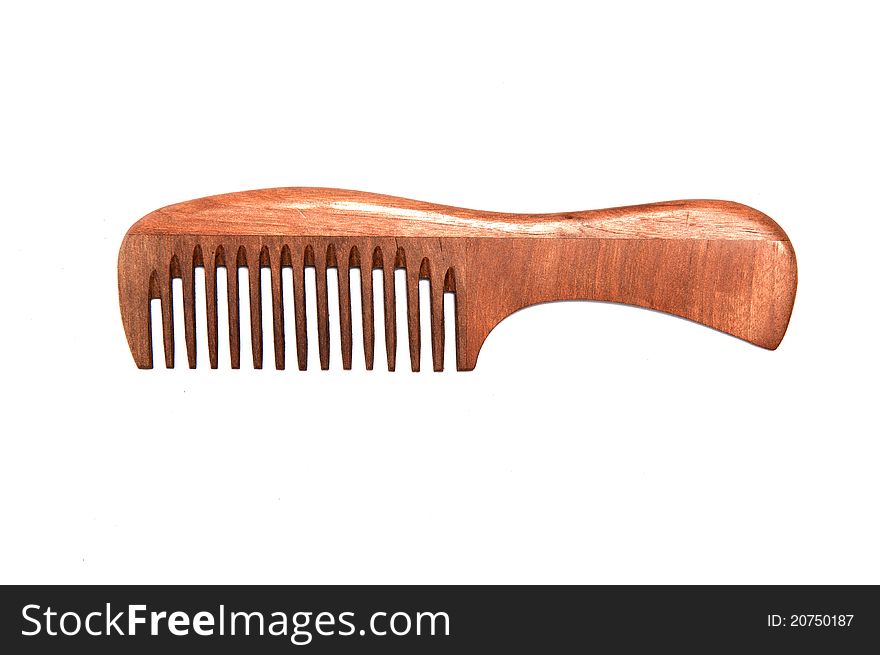 Wooden comb on white background. Wooden comb on white background.