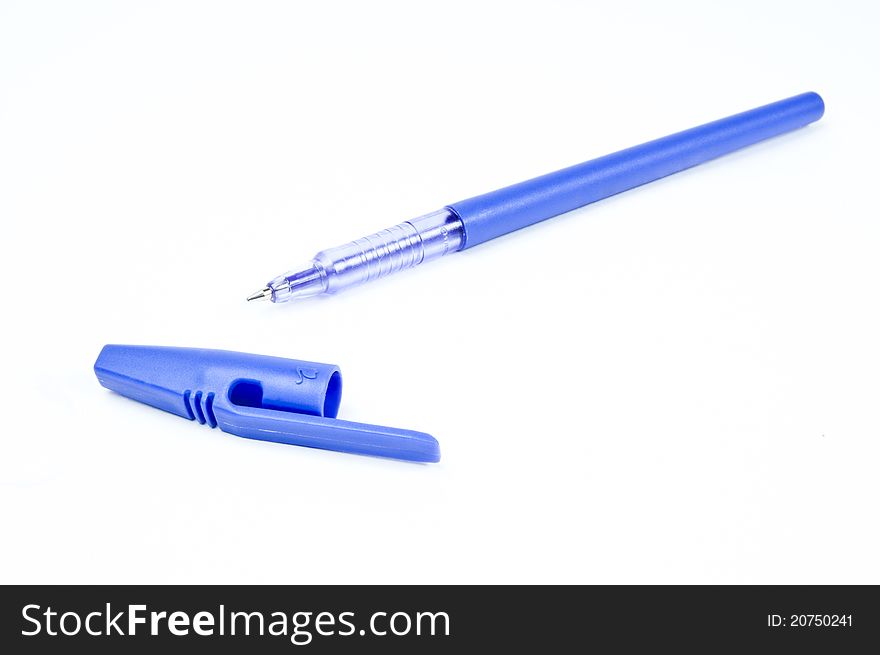 Blue writing pen against white. Blue writing pen against white.