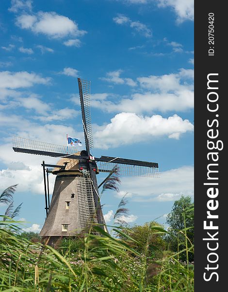 A windmill near Kinderdijk in the Netherlands. Listed as a world heritage by the UN. A must see for tourists in the Netherlands. A windmill near Kinderdijk in the Netherlands. Listed as a world heritage by the UN. A must see for tourists in the Netherlands.