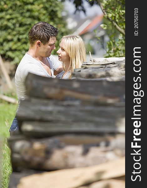 Young romantic couple embracing in countryside