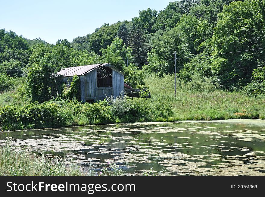 Old abandoned barn by pond in Illinois. Old abandoned barn by pond in Illinois