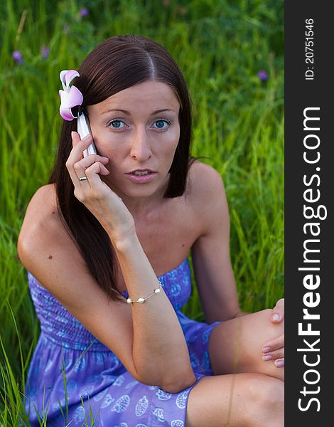 Girl talking on the phone in the park