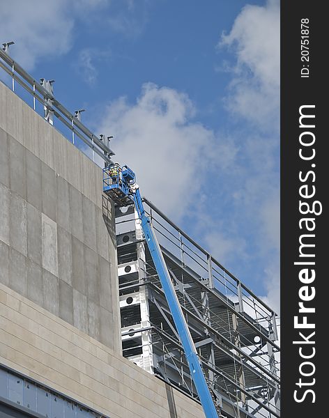 A Blue Cherry Picker Platform on a construction site