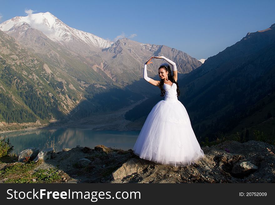 Romantic Girl In A Wedding Dress On A White Nature