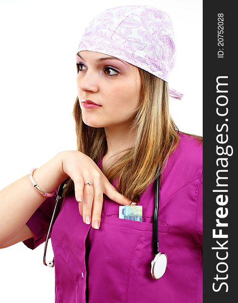 Beautiful nurse with stethoscope and money in her pocket