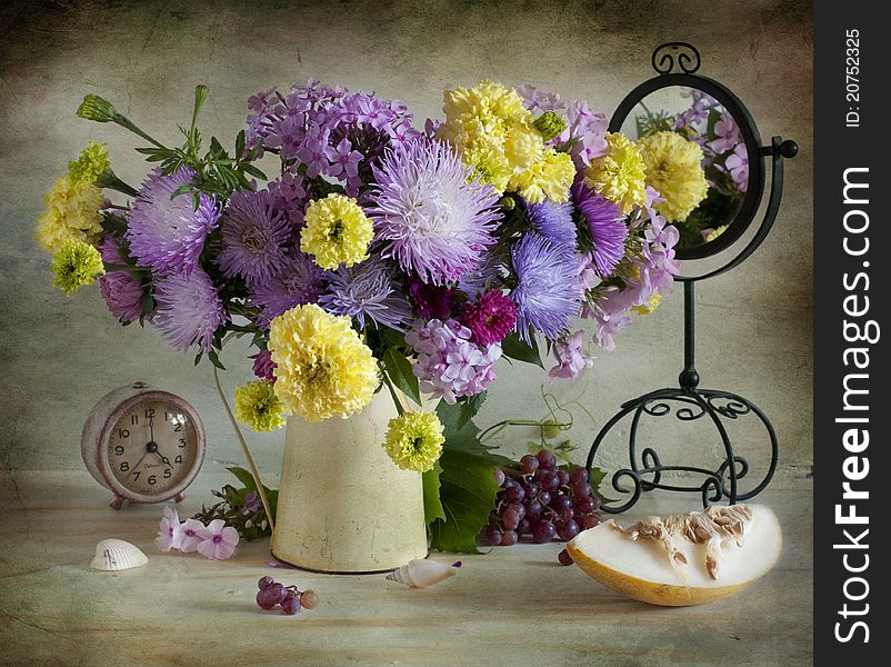Still life with asters, marigolds, vine and old mirror. Still life with asters, marigolds, vine and old mirror