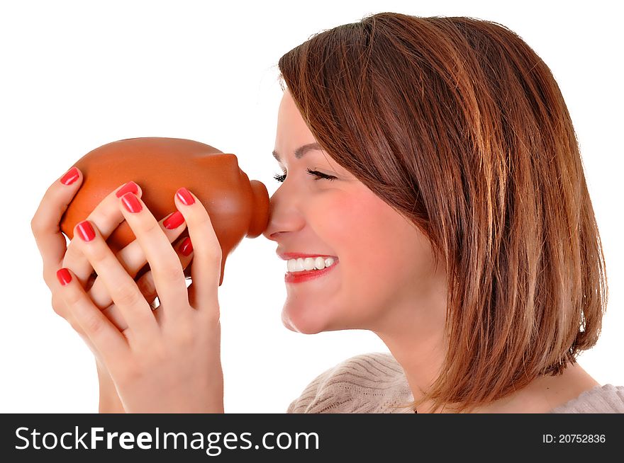 Young woman holding a piggy bank