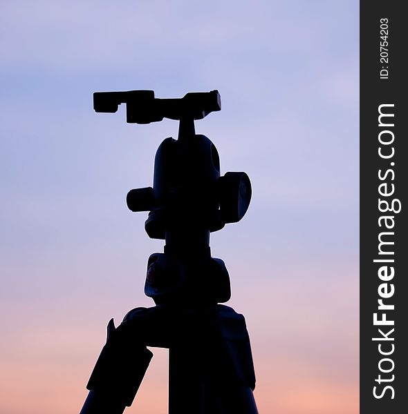 Silhouette of a Tripod with sunset