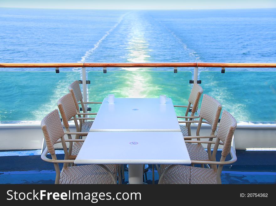 Dining table and chairs with ocean view