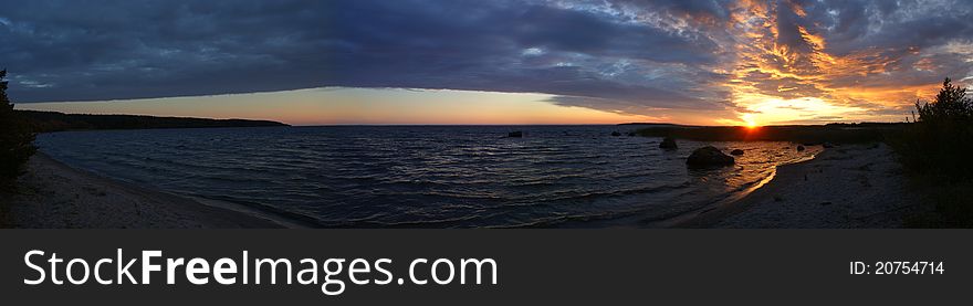 Karelian landscape, sunset on the lake, panorama of lake Onega. Karelian landscape, sunset on the lake, panorama of lake Onega