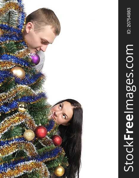 Man and woman staring at each nodule because of the Christmas Tree. Man and woman staring at each nodule because of the Christmas Tree