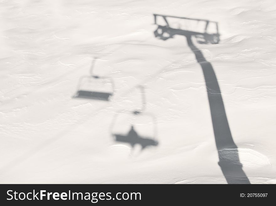 The Shadow of the Chairlift on the snow. The Shadow of the Chairlift on the snow