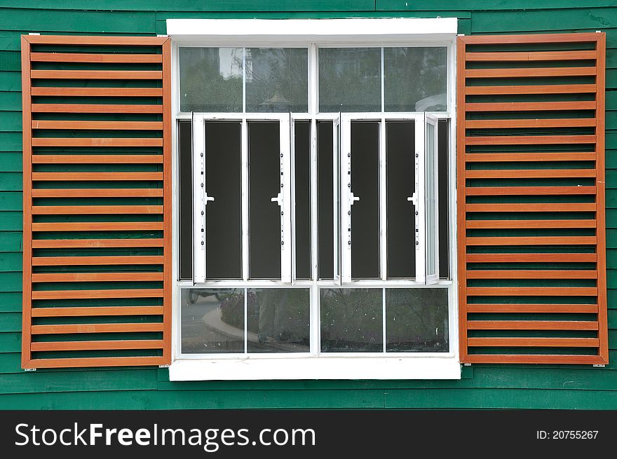 Big beautiful window in grid and brown color, shown as featured architecture pattern. Big beautiful window in grid and brown color, shown as featured architecture pattern.