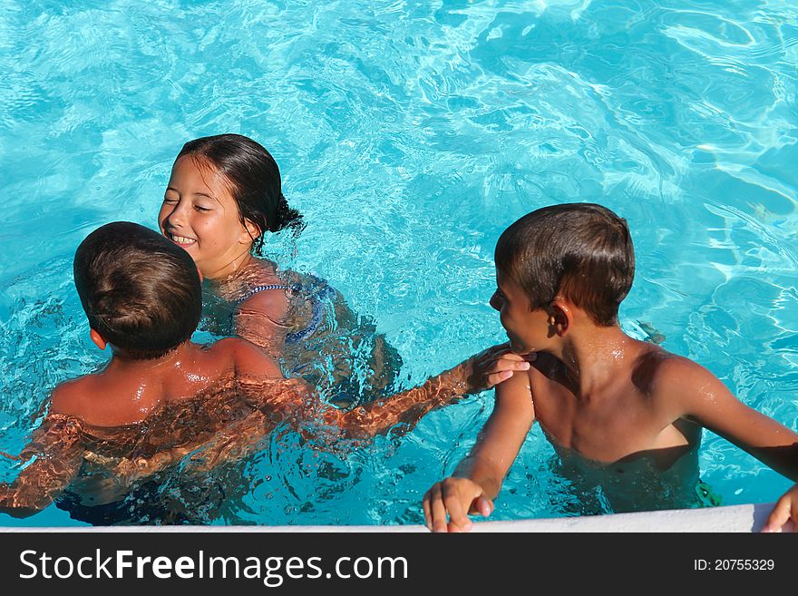 Children playing in a pool. Children playing in a pool