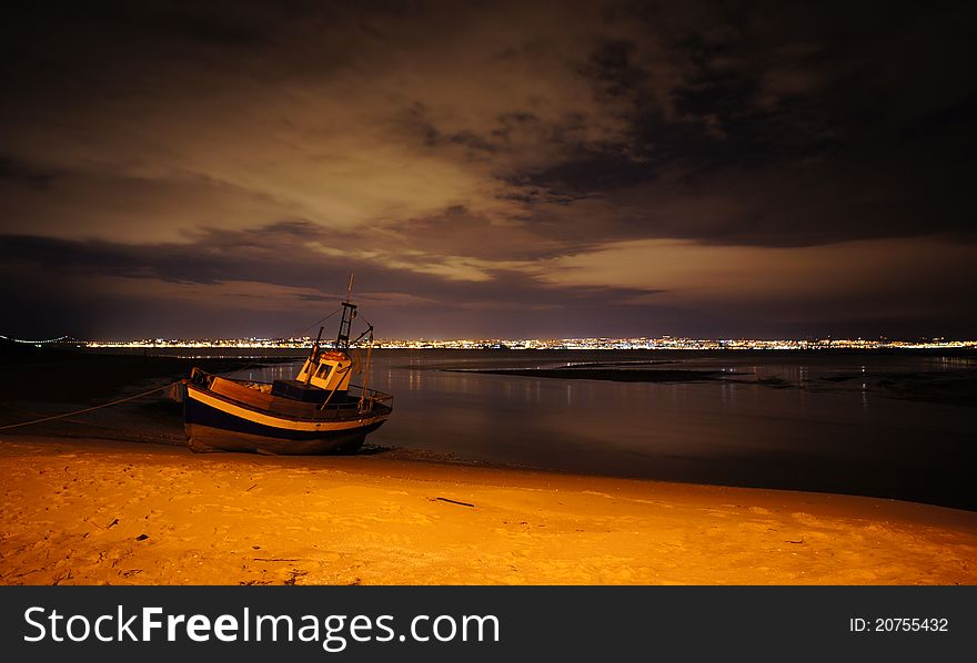 Fishing boat on shore at night. Fishing boat on shore at night