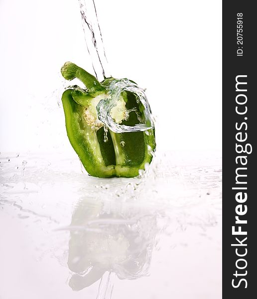 Very fresh green paprika with water splash