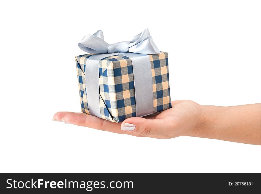 Gift box with ribbon in hand on a white background