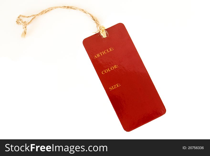 Red paper label with rope on a white background