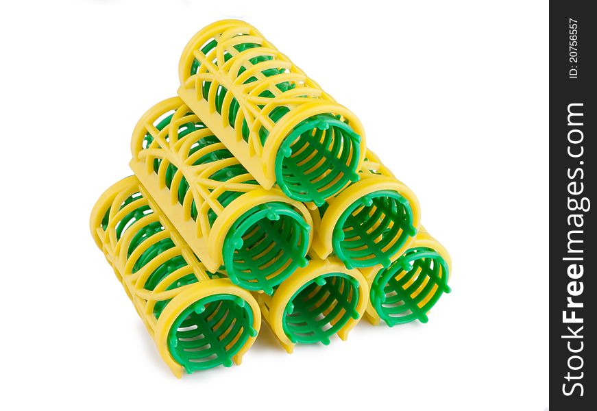 Stack of hair rollers isolated on a white background