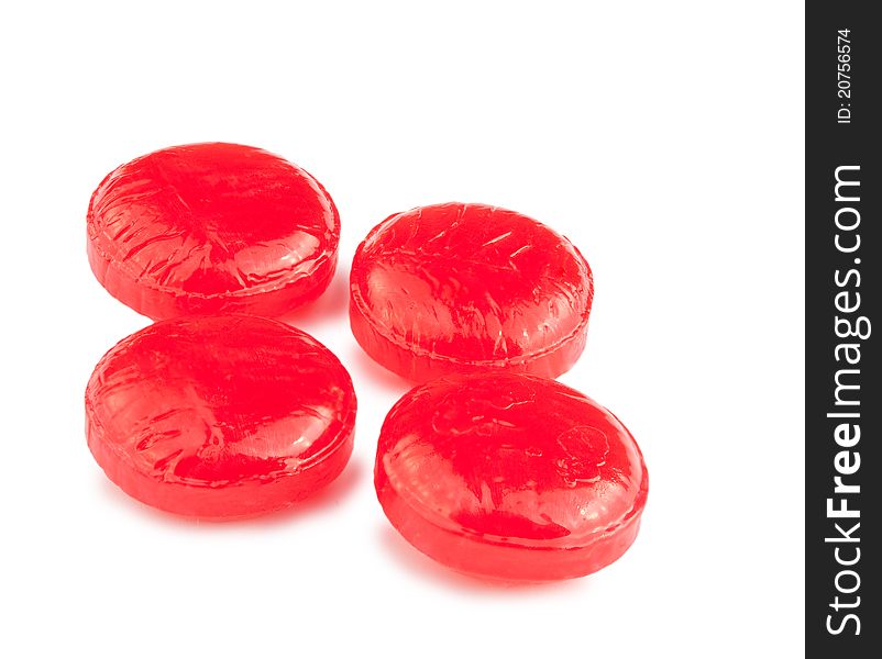 Some round red pills isolated on a white background