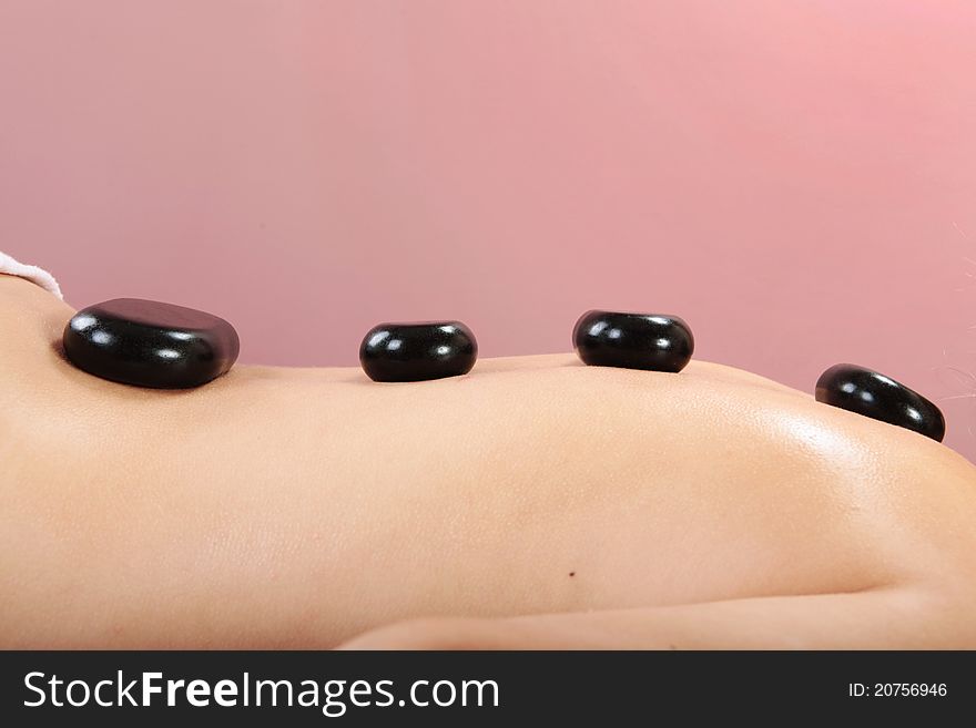 Massage with hot stones in spa