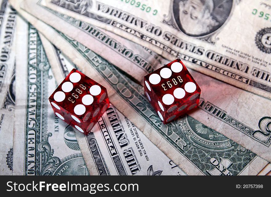 These are 2 red dices with USD-Bills. These are 2 red dices with USD-Bills