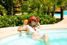 Beautiful Woman In Swimming Pool With Cocktail Royalty Free Stock Image