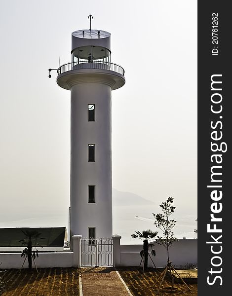 A round modern lighthouse on the coast in southern Korea. A round modern lighthouse on the coast in southern Korea