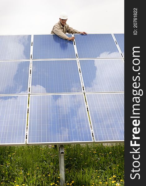 Technician Working On Solar Panels