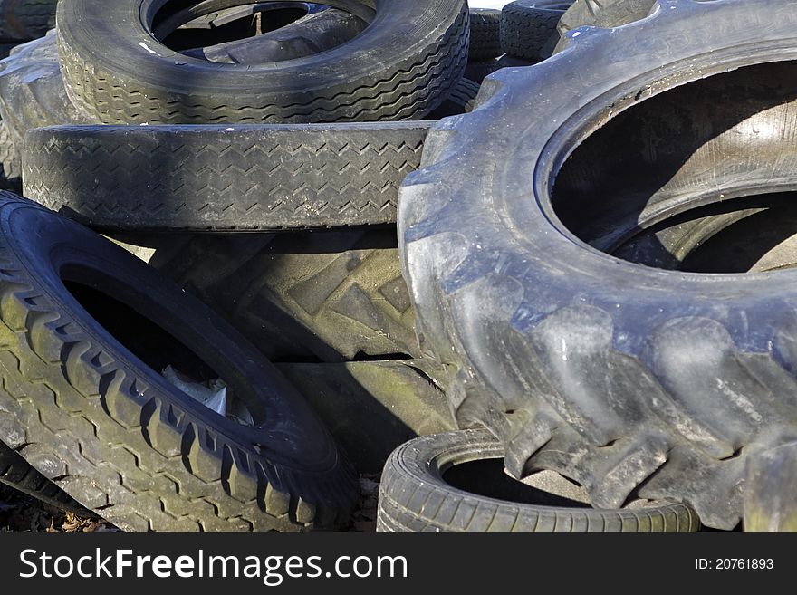 A pile of old car tires. A pile of old car tires