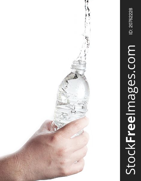 Human hand holding a bottle of water with water splash. Human hand holding a bottle of water with water splash