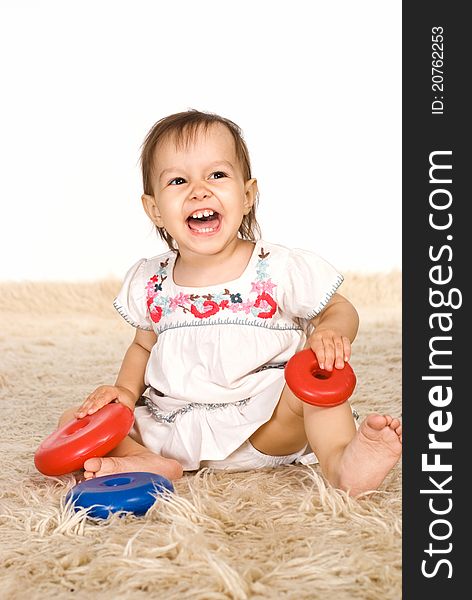 Girl playing on carpet