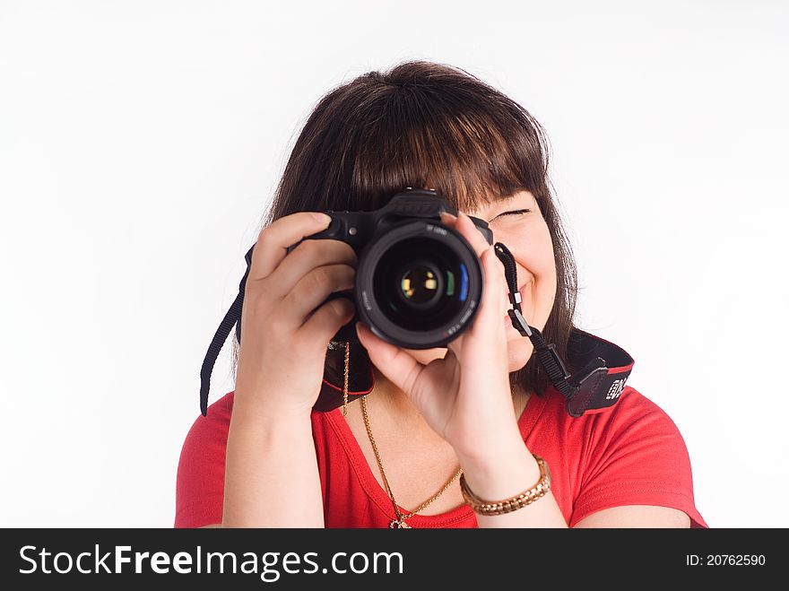 Girl with camera on a white background