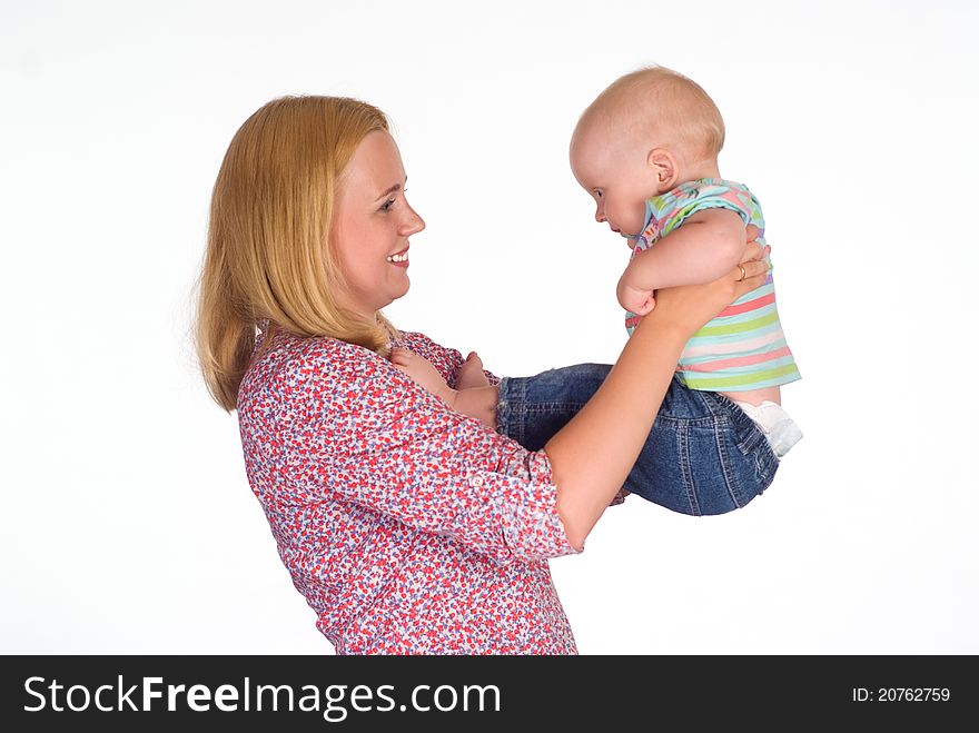 Cute mom holding her baby on whie. Cute mom holding her baby on whie