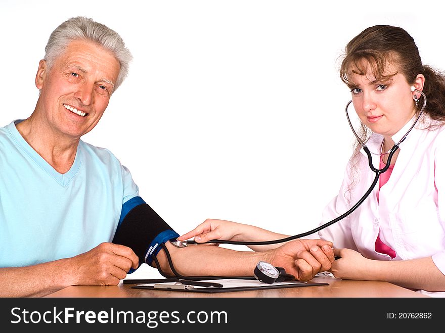 Old man with nurse sit at table on white. Old man with nurse sit at table on white