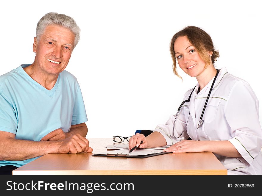 Old man with nurse sit at table on white. Old man with nurse sit at table on white