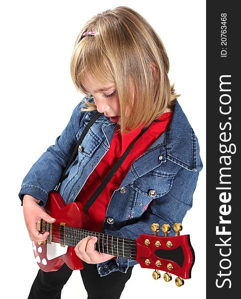 Little girl playing a red guitar on a white background. Little girl playing a red guitar on a white background