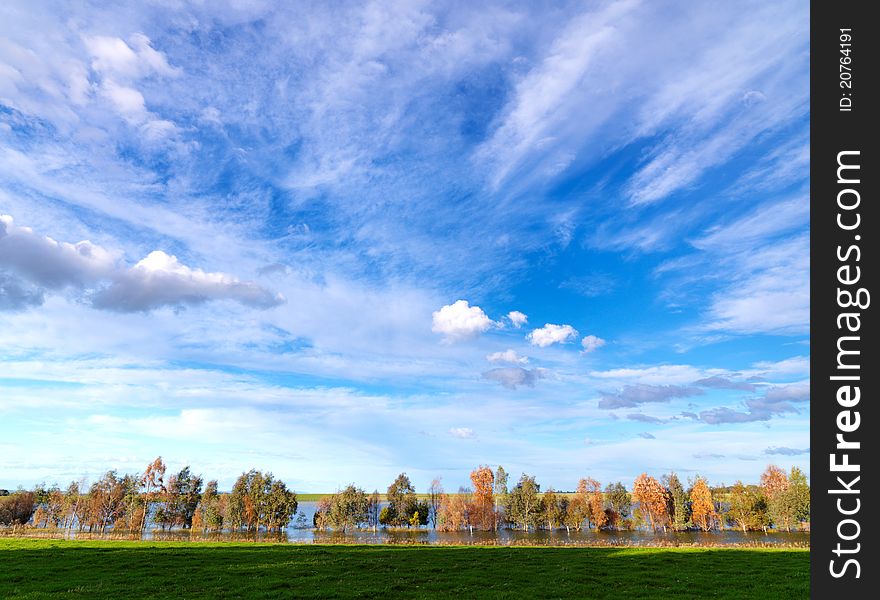 White Clouds Blue Sky Over Lake