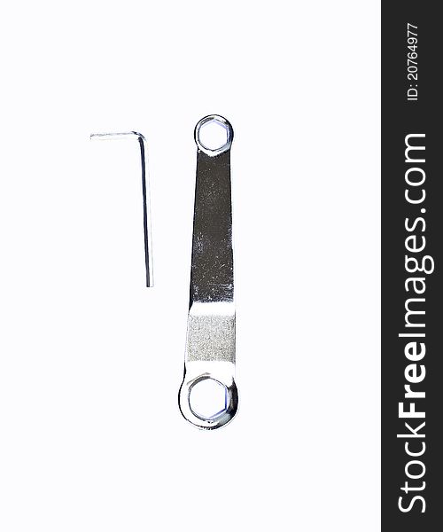 Hex key and ring spanner wrench on a white background. Hex key and ring spanner wrench on a white background