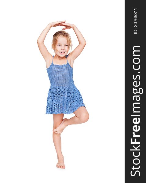 Funny pretty little girl in blue dress isolated on white background.