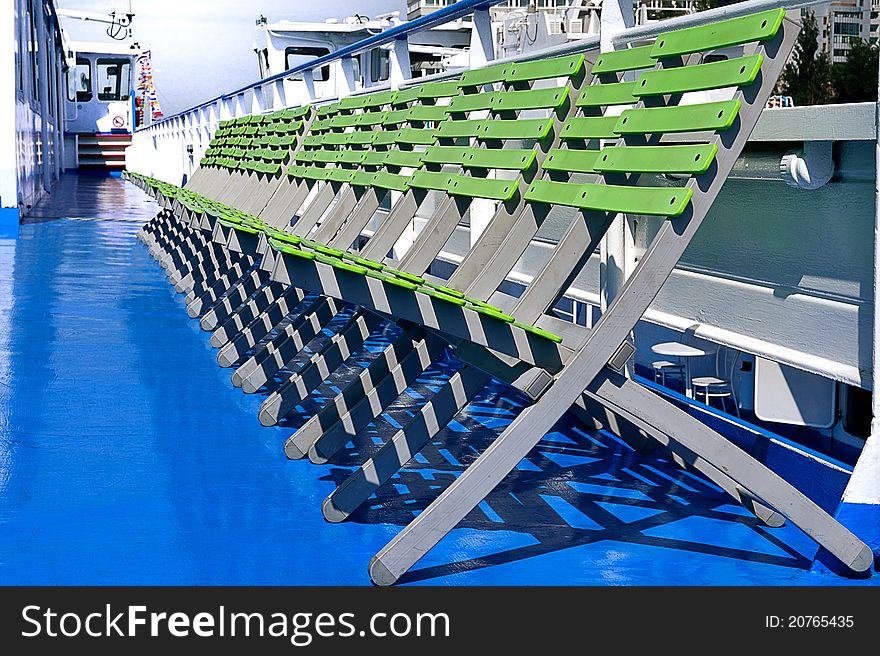 Row of chairs on the deck of the ship